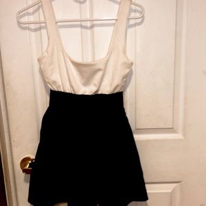 This a black and white mini aqua dress in a size medium